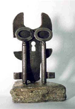 metal owl and key sculpture