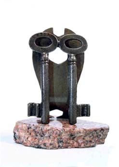 metal owl and key sculpture