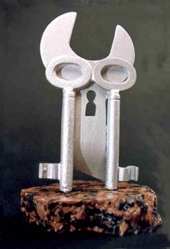 metal owl and key sculpture