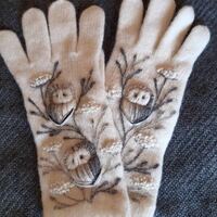 Hand knitted winter gloves with embroidery owls