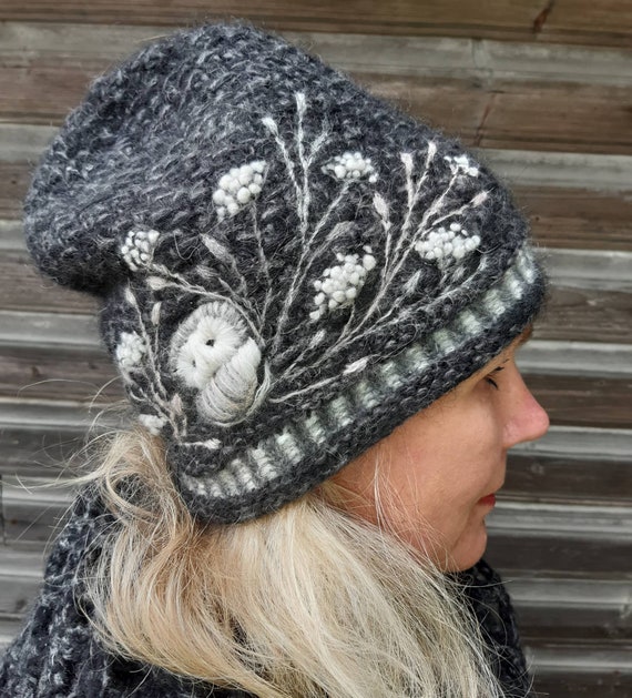 Hand knitted beanie hat with embroidery owls