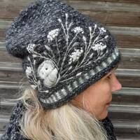 Hand knitted beanie hat with embroidery owls