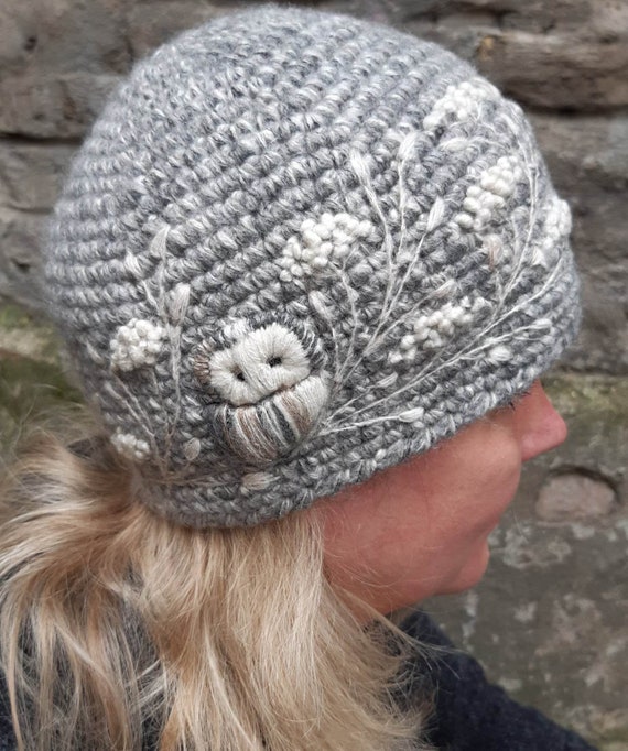 Crochet merino wool winter hat with embroidery owls
