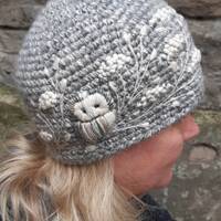 Crochet merino wool winter hat with embroidery owls