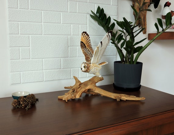 Short-eared owl, a wooden sculpture of an owl, Asio flammeus.