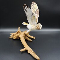 Short-eared owl, a wooden sculpture of an owl.