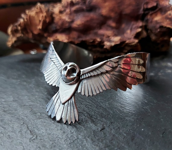 Silver owl cuff with moon and stars design, layered ,textured and oxidised. Silver owl bracelet