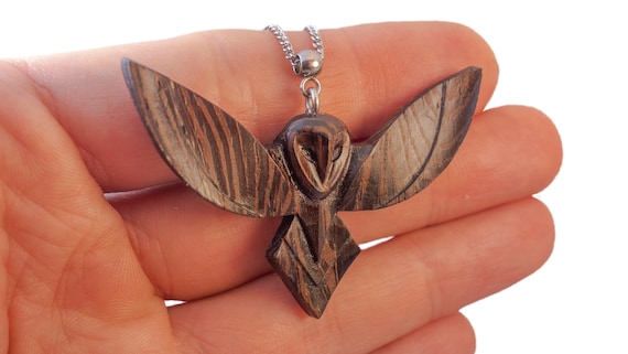 Exquisite handmade wooden pendant – a flying owl in a minimalist style.