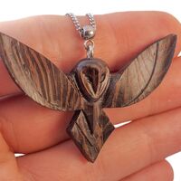 Exquisite handmade wooden pendant – a flying owl in a minimalist style.