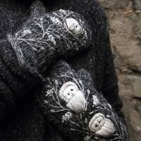 Hand knitted wool mittens with embroidery owls