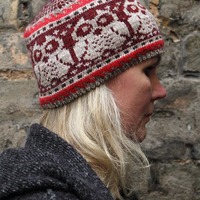 Knitted winter hat with owl