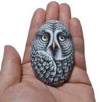 Great Gray Owl hand painted on natural sea pebble. Painted with acrylics and finished with s...