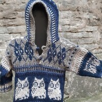 Kids knitted winter sweater with owls