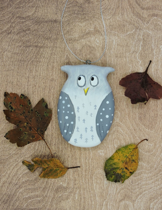Small grey owl, a wooden ornament.