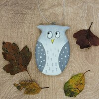 Small grey owl, a wooden ornament.