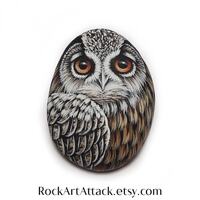 Eurasian eagle owl hand painted on small sea pebble